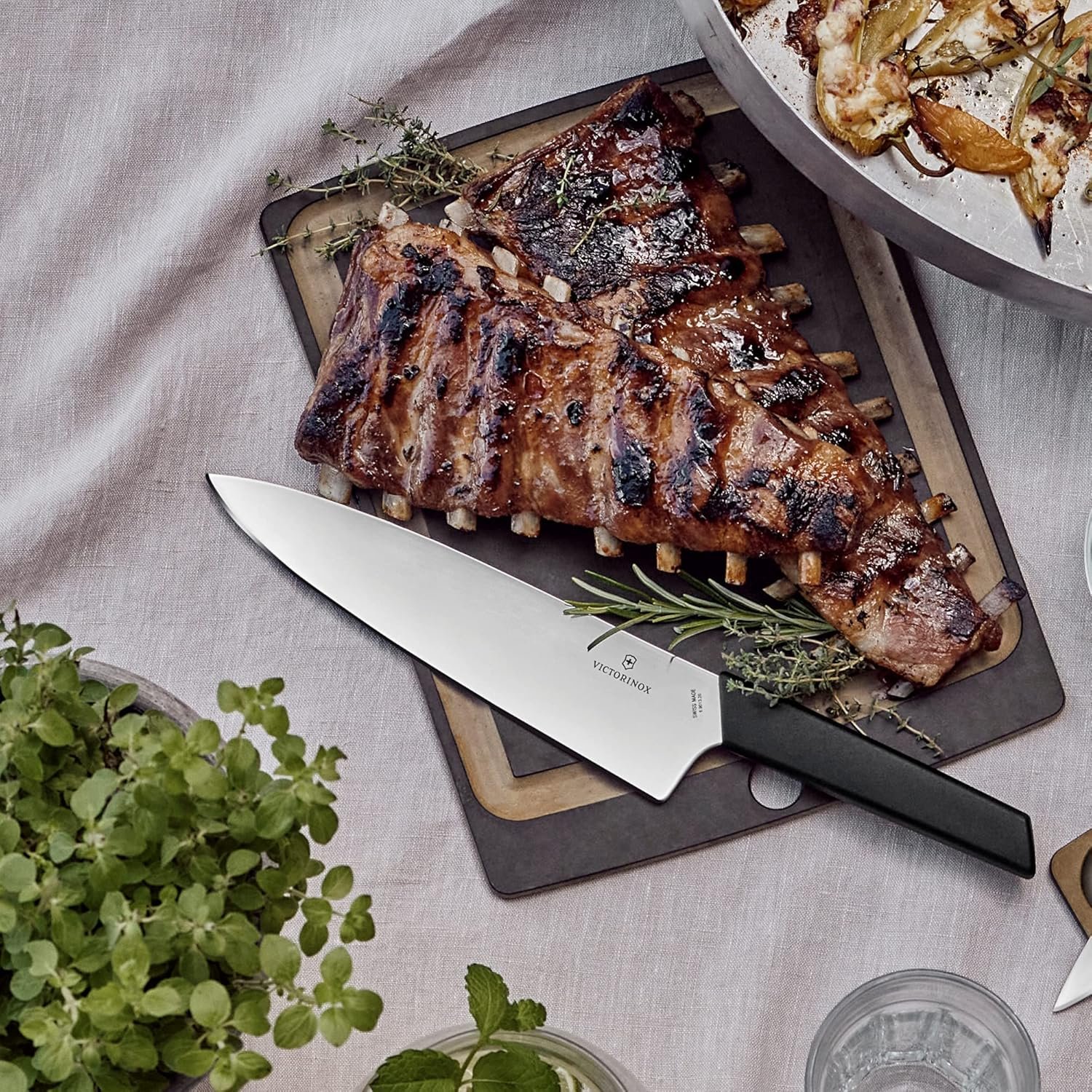 Victorinox Swiss Modern Chef's Knife - Kitchen Knife for Cutting Meat, Fruit & Vegetables - Premium Kitchen Accessories - Black Handle, 8" - Image 4